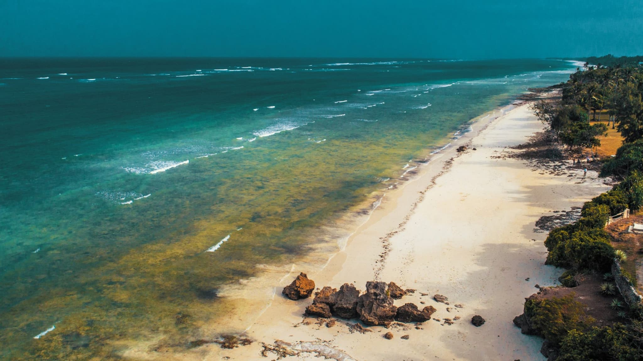 Aerial view of Diani Beach, Kenya — turquoise reef and white sand